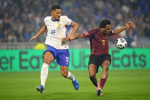 2024–25 UEFA Nations League, France vs Belgium: France's William Saliba, left, tries to stop Belgium's Lois Openda